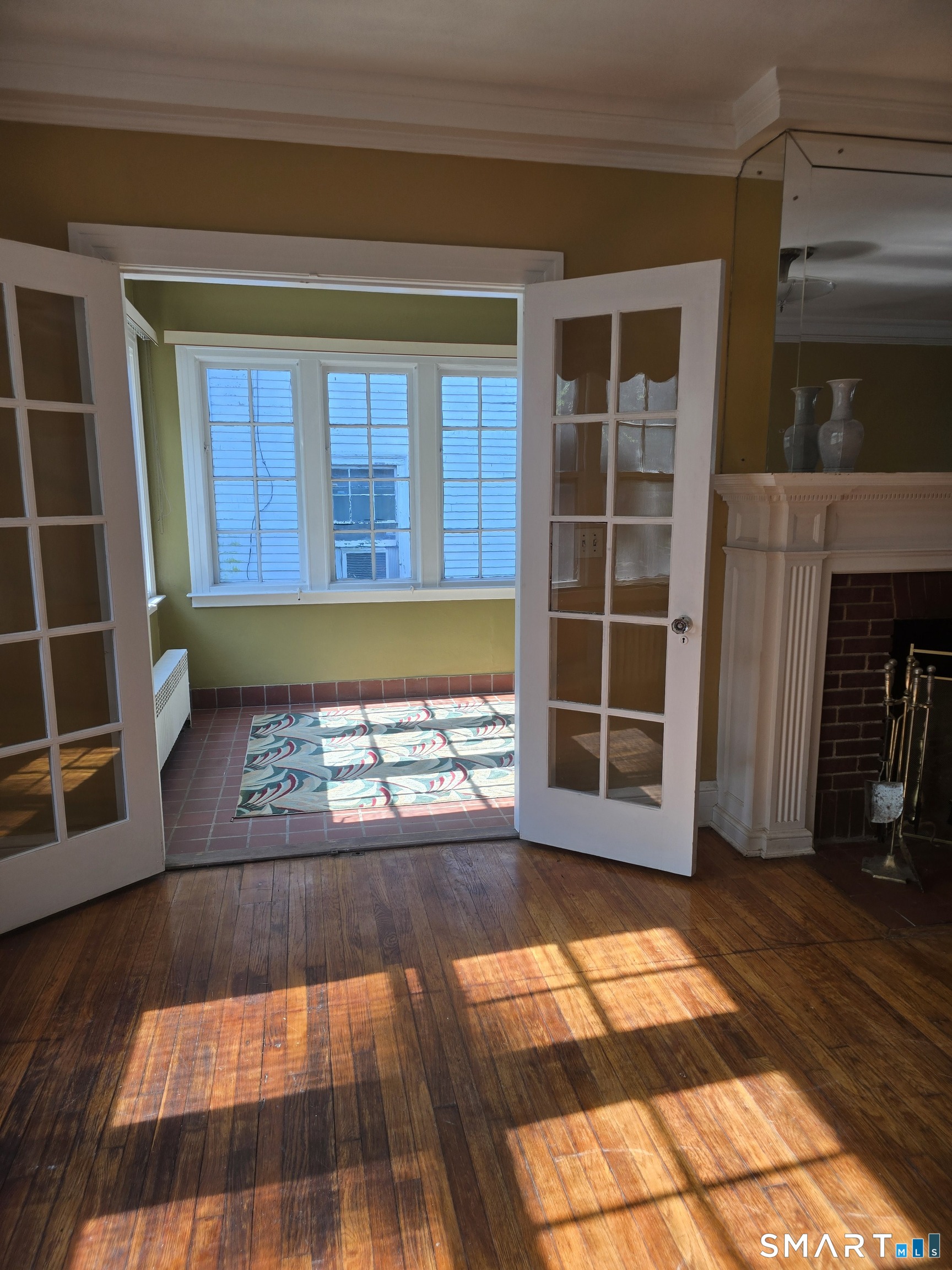 197 Ridgefield Street Hartford, CT 06112 - Photo 8 of 26 Two sets Of Double French Doors entering Sun Parlor