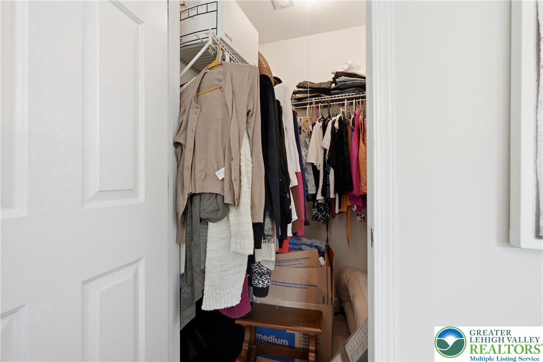 245 East Dell Road Bath, PA 18014 - Photo 45 of 99 Streamlined organization awaits with this ample walk-in closet, maximizing storage potential for any homeowner.