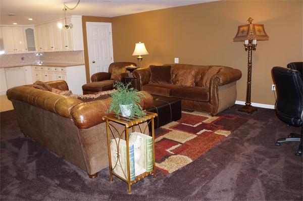 32 Cherokee Road Canton, MA 02021 - Photo 25 of 30 a living room with furniture a couch and a dining table