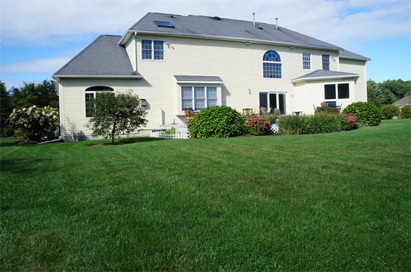 32 Cherokee Road Canton, MA 02021 - Photo 27 of 30 a front view of a house with a garden
