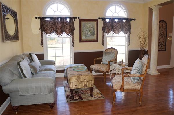 32 Cherokee Road Canton, MA 02021 - Photo 9 of 30 a living room with furniture a fireplace and a chandelier