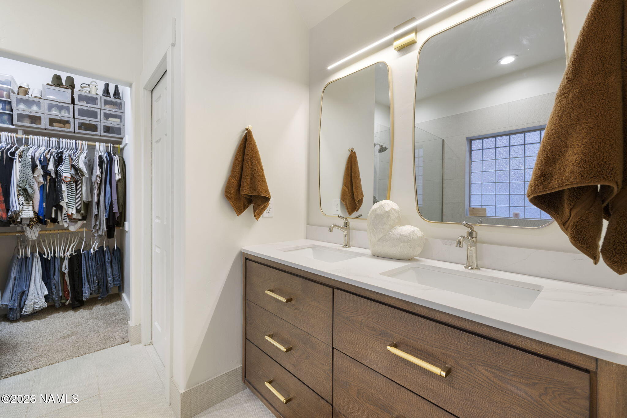 3495 West Lead Rope Flagstaff, AZ 86005 - Photo 23 of 49 a bathroom with a double vanity sink and a mirror