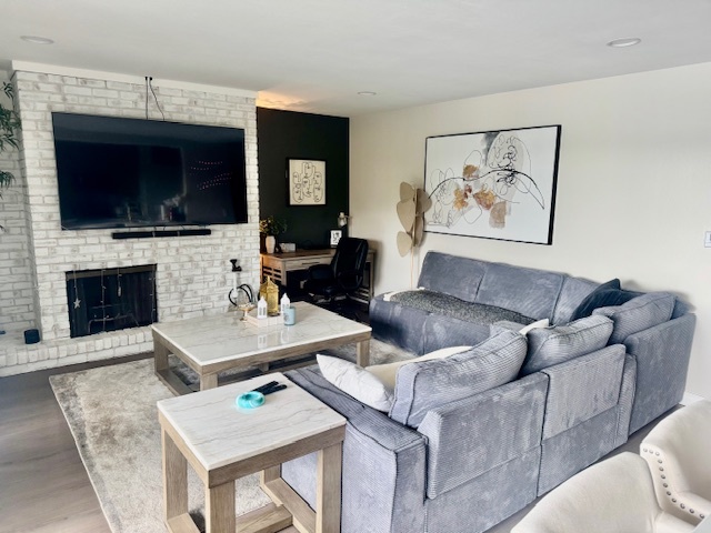 1601 Maple Terrace, Unit 3B Lisle, IL 60532 - Photo 3 of 6 a living room with furniture fireplace and flat screen tv