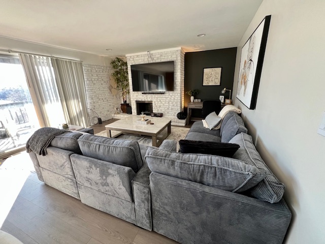 1601 Maple Terrace, Unit 3B Lisle, IL 60532 - Photo 4 of 6 a living room with furniture and a flat screen tv