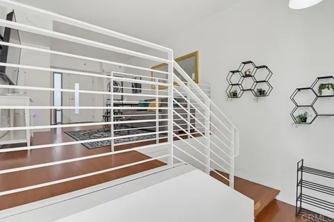 a view of an empty room with stairs