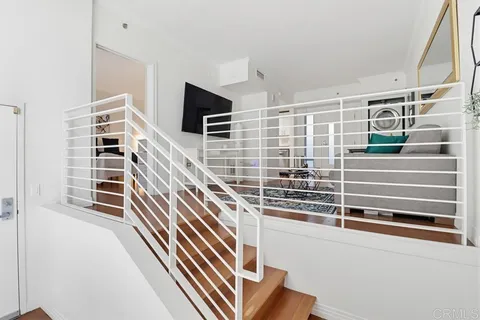 a living room with furniture and a rug