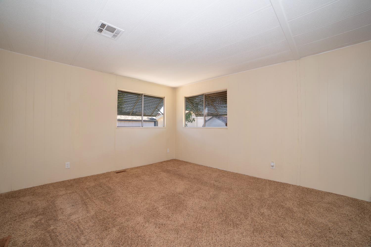1200 South Carpenter Road, Unit 71 Modesto, CA 95351 - Photo 19 of 27 an empty room with windows
