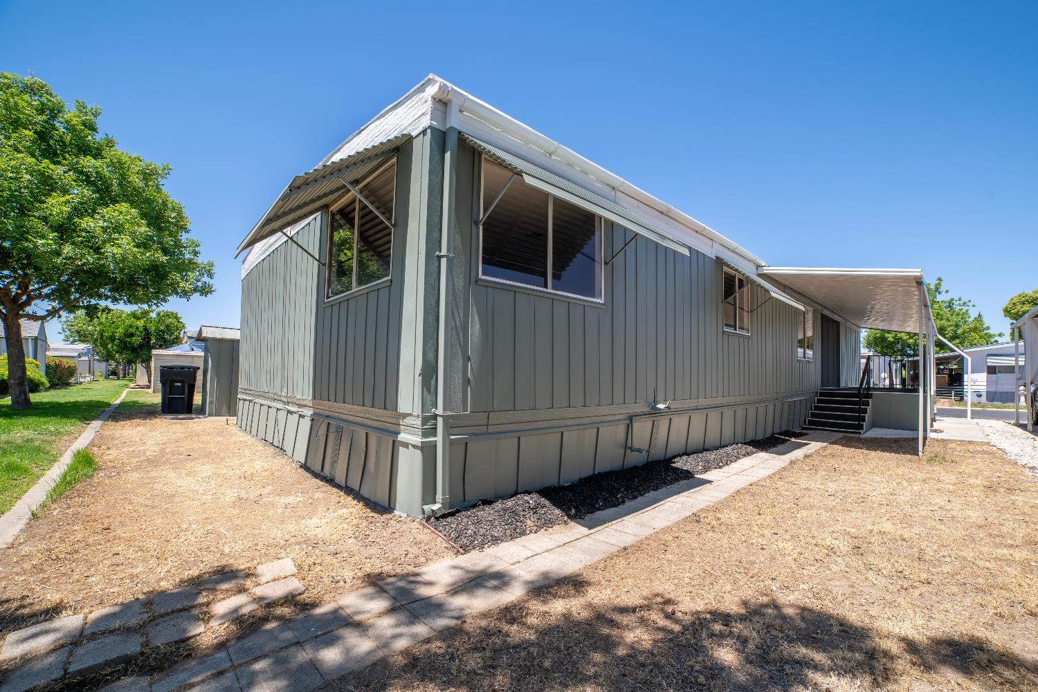 1200 South Carpenter Road, Unit 71 Modesto, CA 95351 - Photo 7 of 27 a view of a house with wooden fence