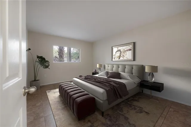 a bed room with a bed and a chandelier