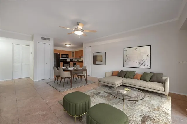 a living room with furniture a dining table and kitchen view