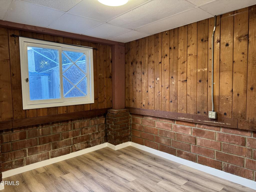 3951 East Cesar E Chavez Avenue Los Angeles, CA 90063 - Photo 11 of 13 a view of a door with wooden walls