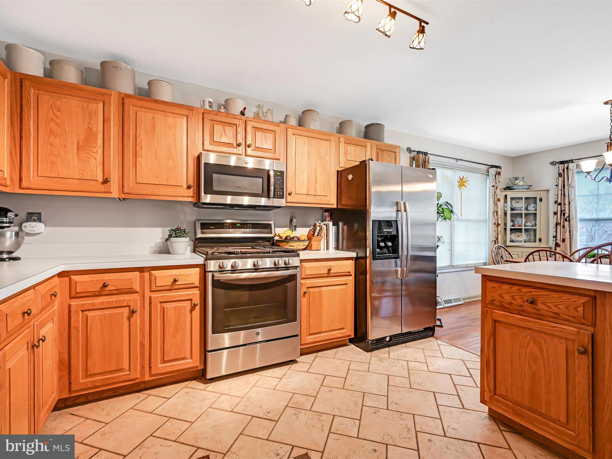 329 North New Street Lititz, PA 17543 - Photo 4 of 20 a kitchen with stainless steel appliances granite countertop a refrigerator and stove
