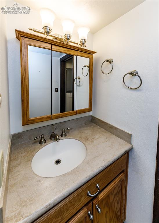 1034 Fontmore Road, Unit D Colorado Springs, CO 80904 - Photo 26 of 43 a bathroom with a sink and a mirror