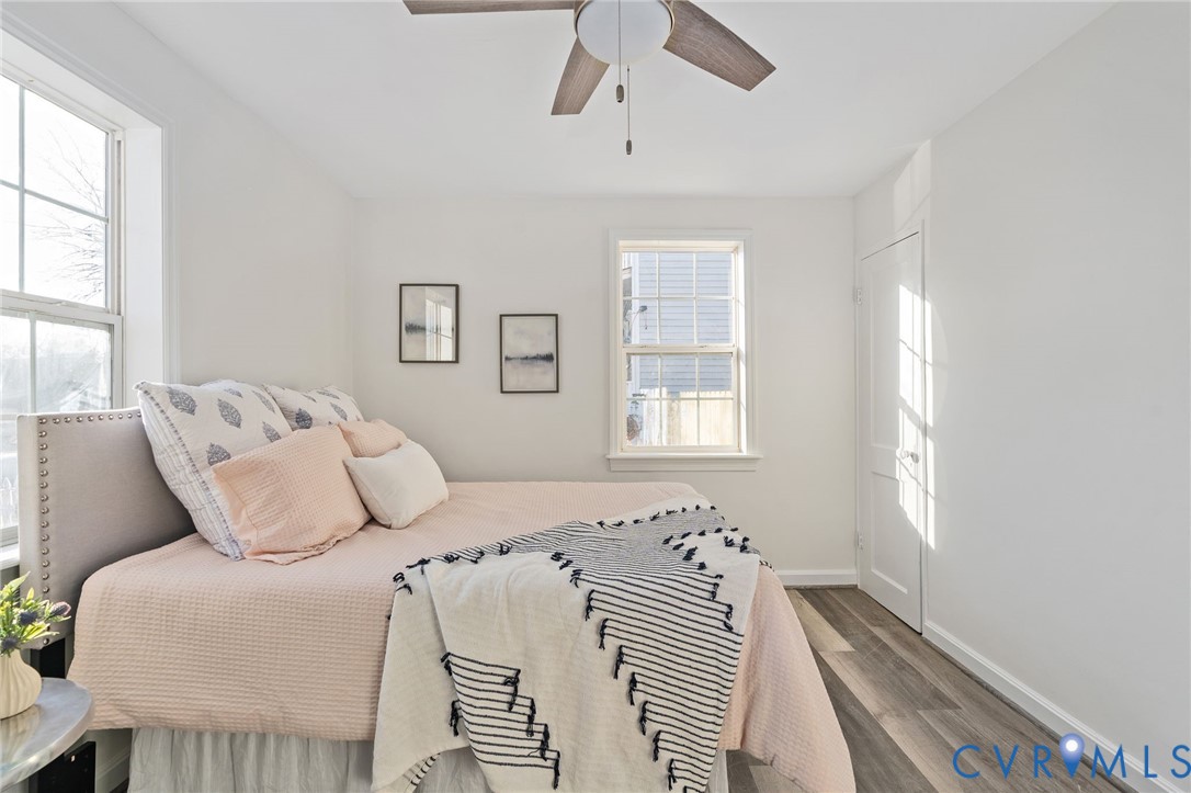 1706 Harvard Road Richmond, VA 23226 - Photo 16 of 27 a bedroom with a bed and wooden floor