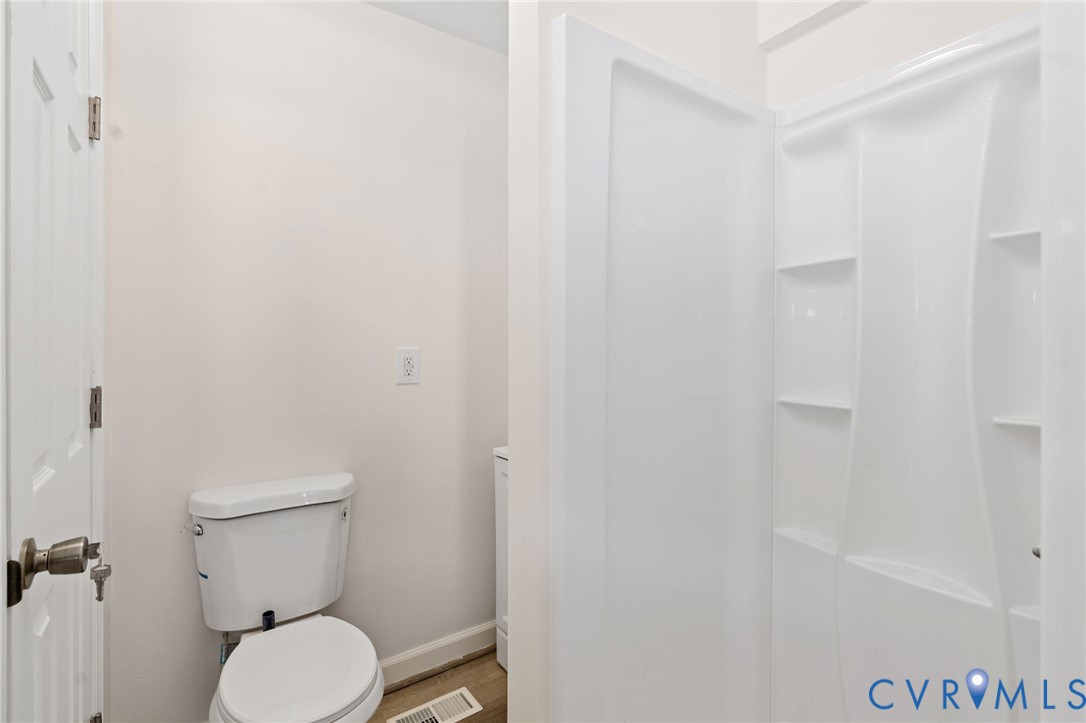 1706 Harvard Road Richmond, VA 23226 - Photo 20 of 27 a white toilet sitting next to a bathroom sink