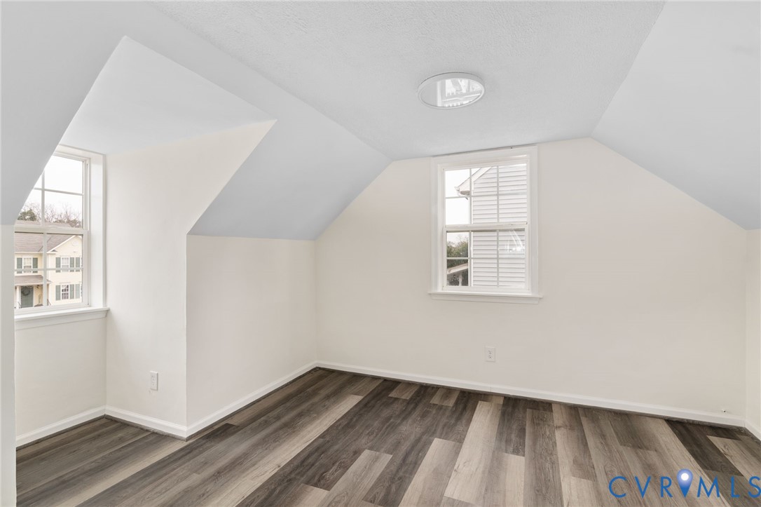 1706 Harvard Road Richmond, VA 23226 - Photo 21 of 27 an empty room with wooden floor and windows