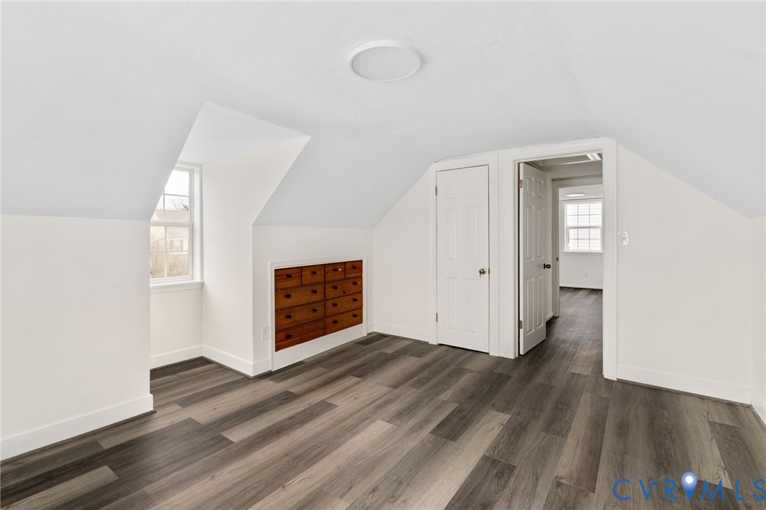 1706 Harvard Road Richmond, VA 23226 - Photo 25 of 27 an empty room with wooden floor and windows