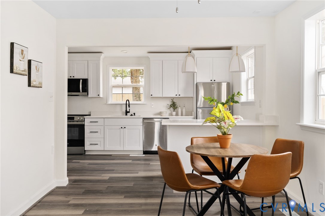 1706 Harvard Road Richmond, VA 23226 - Photo 8 of 27 a kitchen with a dining table chairs and window