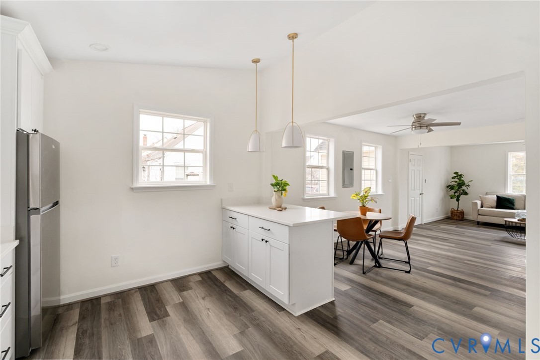 1706 Harvard Road Richmond, VA 23226 - Photo 10 of 27 a view of workspace with wooden floor and furniture
