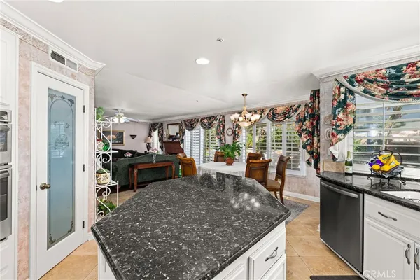 a kitchen with stainless steel appliances granite countertop a sink and cabinets