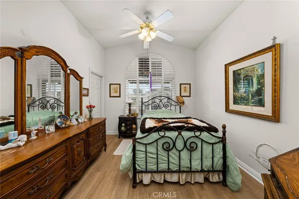 a bedroom with furniture and a window
