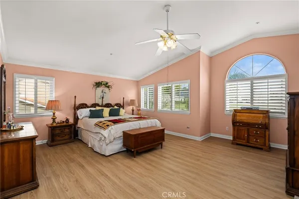 a bed room with a bed and a chair