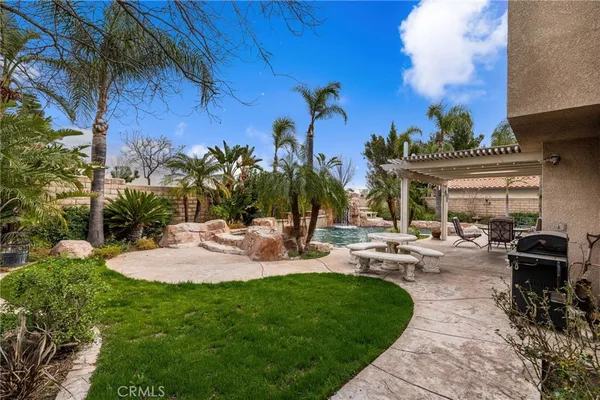 a view of a backyard with sitting area
