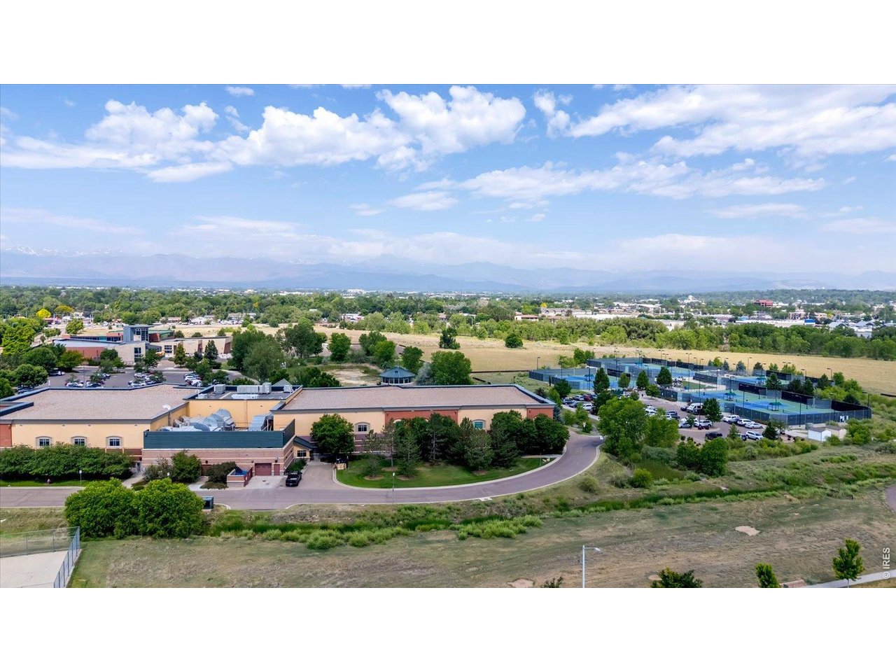 69 Quail Road Longmont, CO 80501 - Photo 25 of 25 View of the side of Longmont Rec Center, w/tennis courts near by.