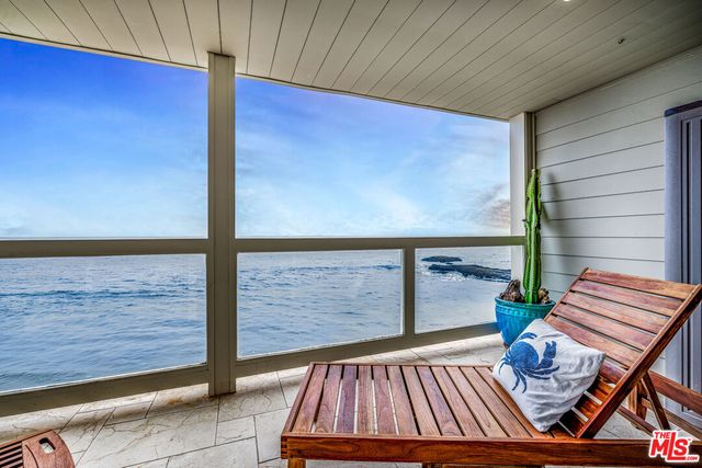 a view of balcony with patio