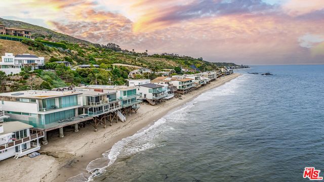 an aerial view of a house with a garden