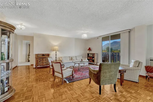 a living room with furniture and a table