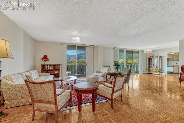 a dining room with furniture and wooden floor