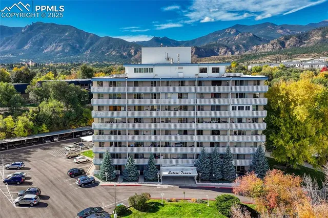 an aerial view of a multi story parking building