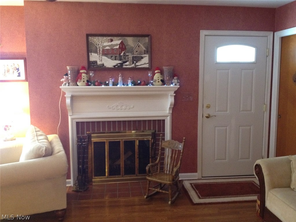 303 Bittersweet Road Akron, OH 44333 - Photo 4 of 20 BEAUTIFUL MANTLE ENHANCES WOODBURNING FIREPLACE IN LIVING ROOM.