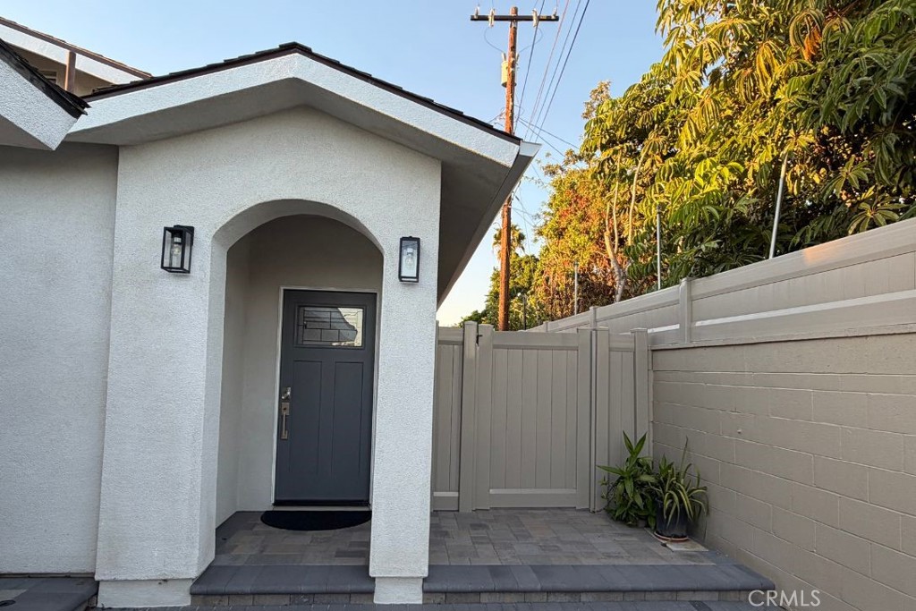 500 North Resh Place, Unit B Anaheim, CA 92805 - Photo 13 of 14 a front view of a house with plants