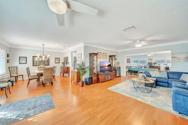 a dining room with furniture and wooden floor