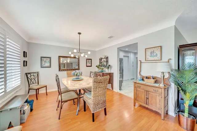 a kitchen with stainless steel appliances granite countertop a refrigerator stove top oven and sink