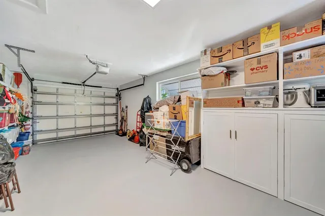 a living room with patio furniture and a potted plants
