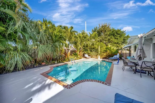a stove top oven sitting inside of a kitchen