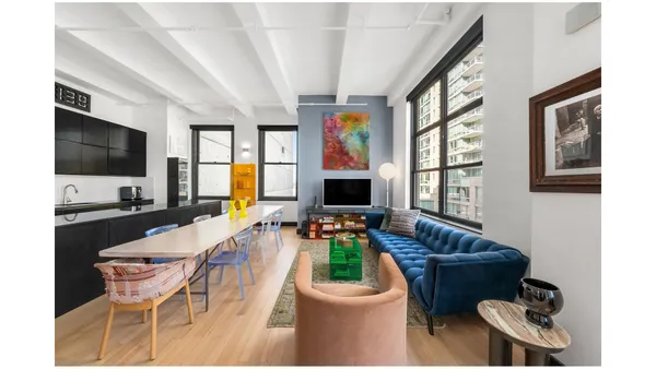 a workspace room with a table and chairs
