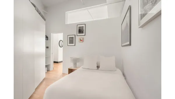 a bathroom with a double vanity sink toilet and mirror