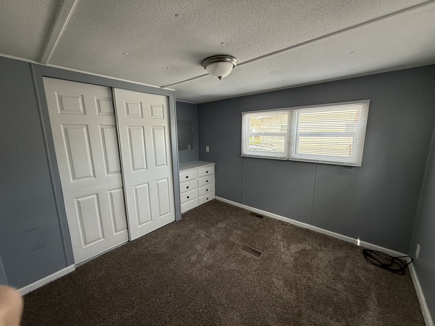 1712 South Dixie Highway, Unit 272 Crete, IL 60417 - Photo 11 of 12 an empty room with windows