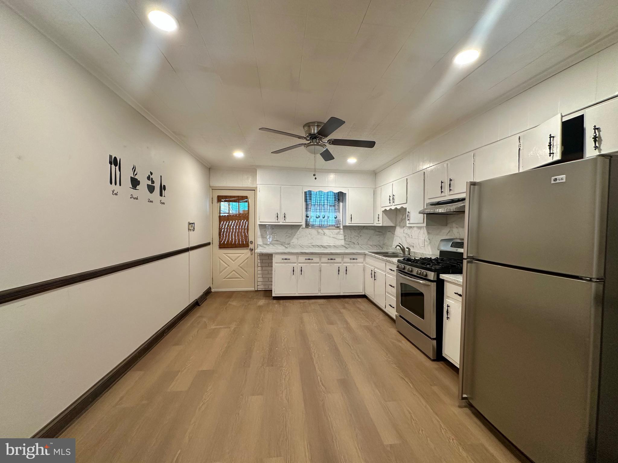 116 Tindall Avenue Hamilton, NJ 08610 - Photo 5 of 12 a kitchen with a refrigerator a sink and dishwasher