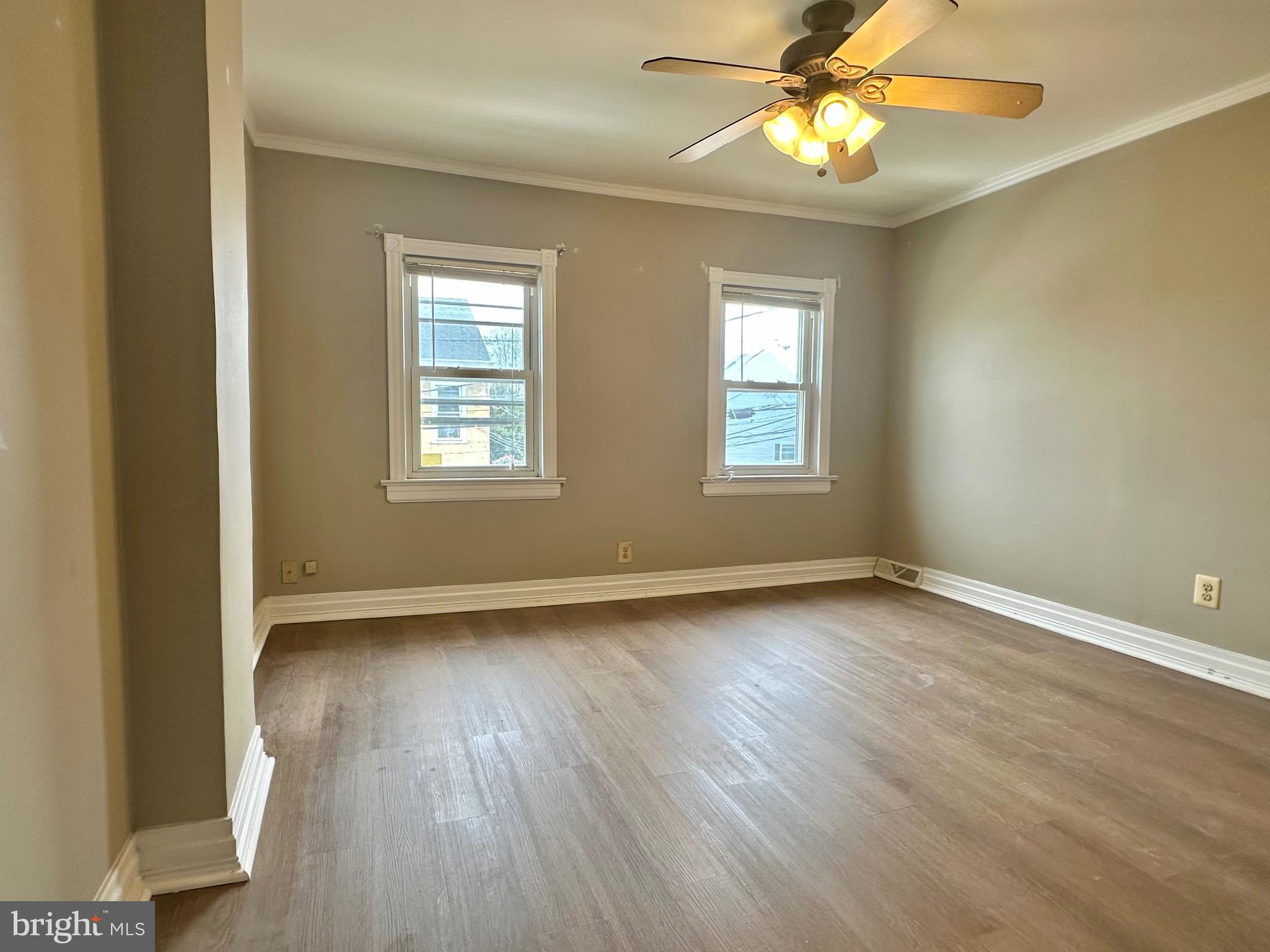 116 Tindall Avenue Hamilton, NJ 08610 - Photo 6 of 12 a view of an empty room with wooden floor and a window