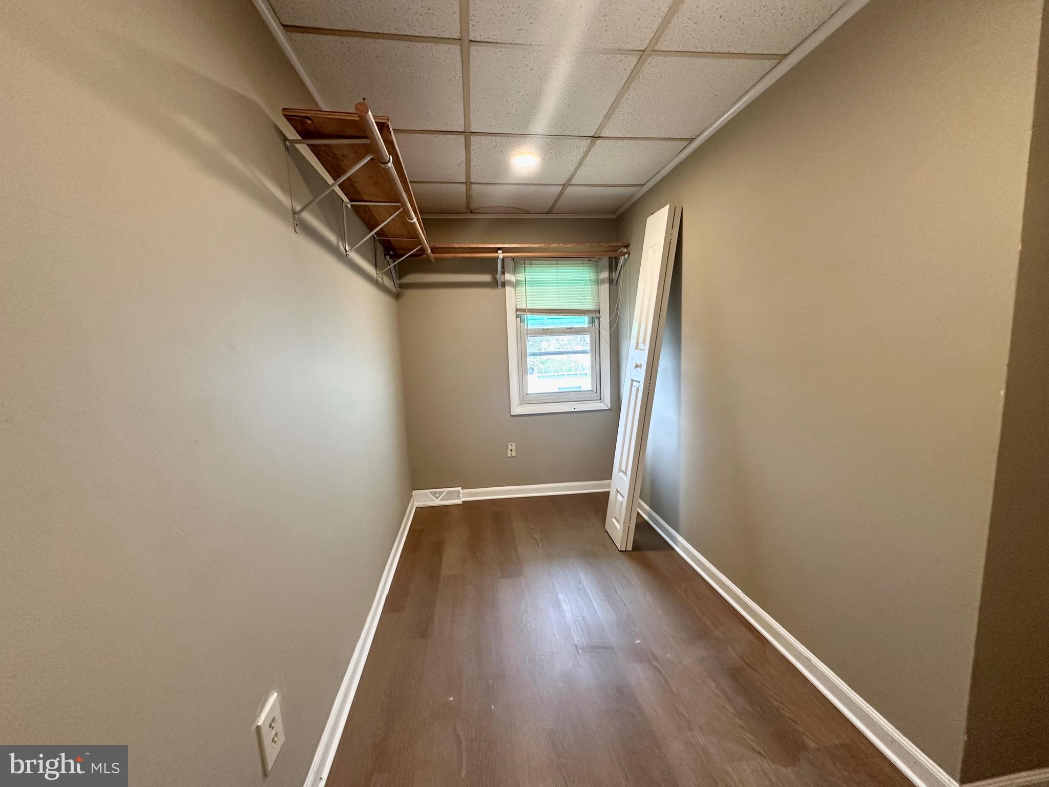 116 Tindall Avenue Hamilton, NJ 08610 - Photo 9 of 12 a view of hallway with stairs and wooden floor