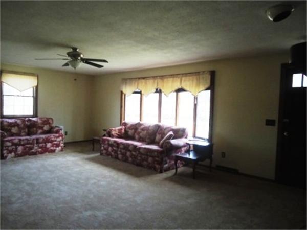 1737 Petersham Road Hardwick, MA 01037 - Photo 11 of 17 a living room with furniture and a window