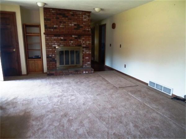 1737 Petersham Road Hardwick, MA 01037 - Photo 10 of 17 a view of an empty room with a fireplace