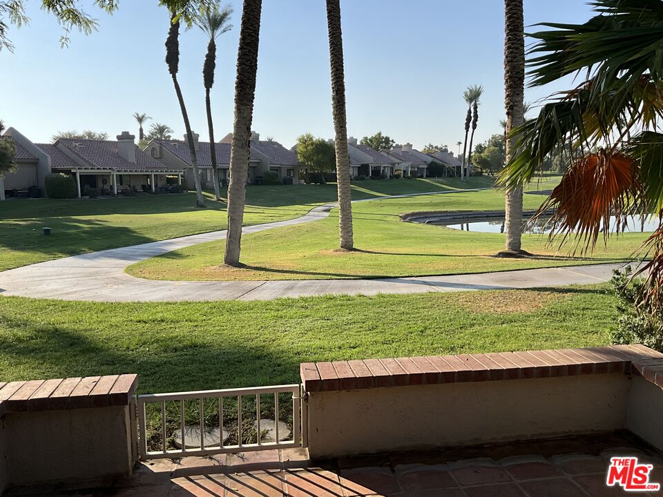 41726 Resorter Boulevard, Unit 516 Palm Desert, CA 92211 - Photo 13 of 17 a view of a garden and basketball court