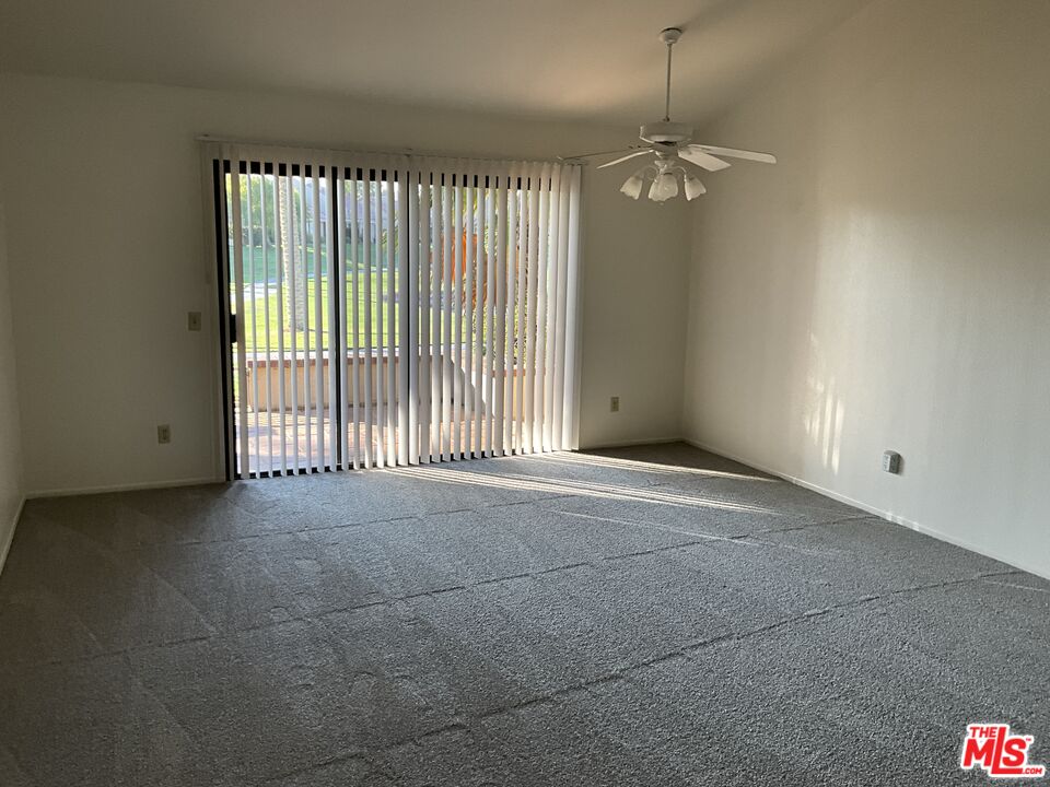 41726 Resorter Boulevard, Unit 516 Palm Desert, CA 92211 - Photo 8 of 17 a view of an empty room with a window