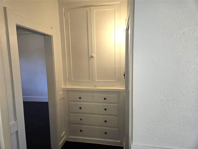 a bathroom with a sink and mirror with toilet
